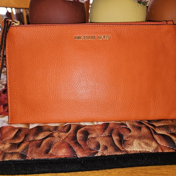 Michael Kors Handbags - Michael Kors Orange Wristlet